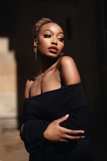 A woman in a black dress posing for a picture
